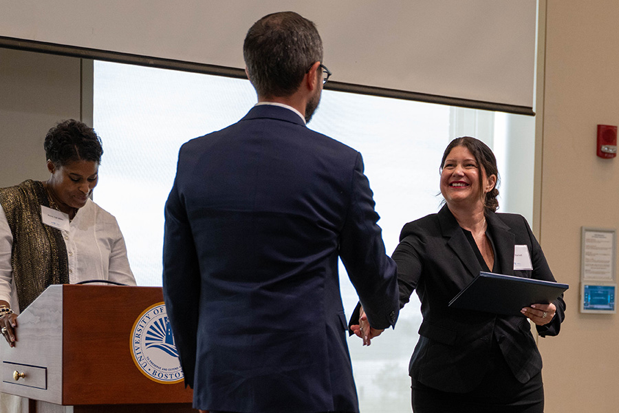 Emerging leader's program graduate receiving certificate for completion